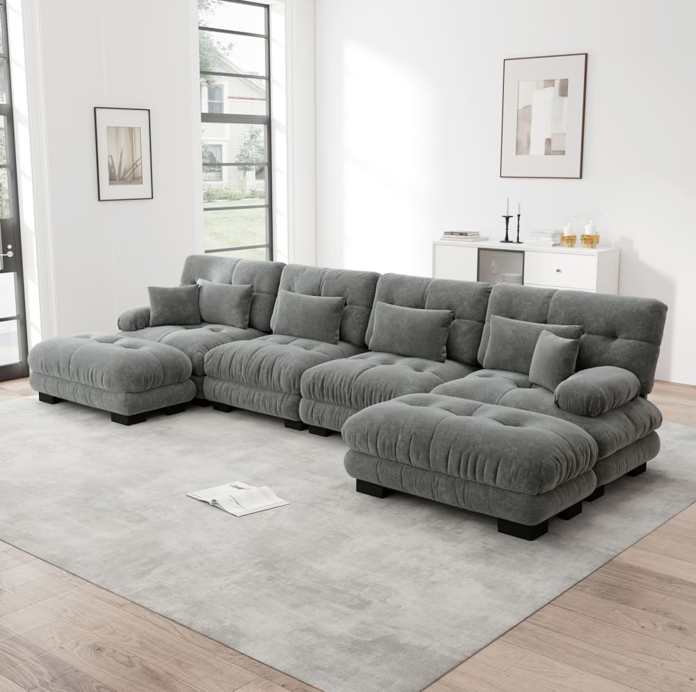 Canapé modulaire gris en chenille avec ottomans mobiles et assise profonde pour salon